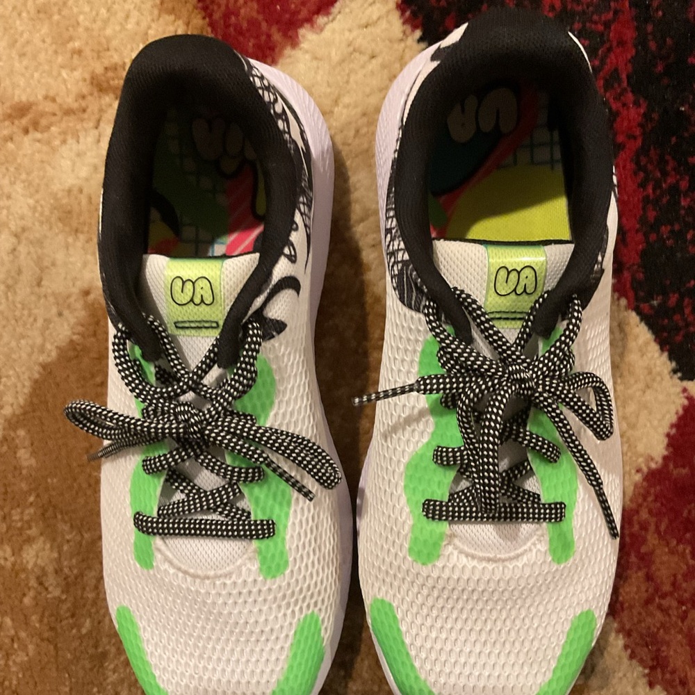 Kids White and Green Under Armour shoes